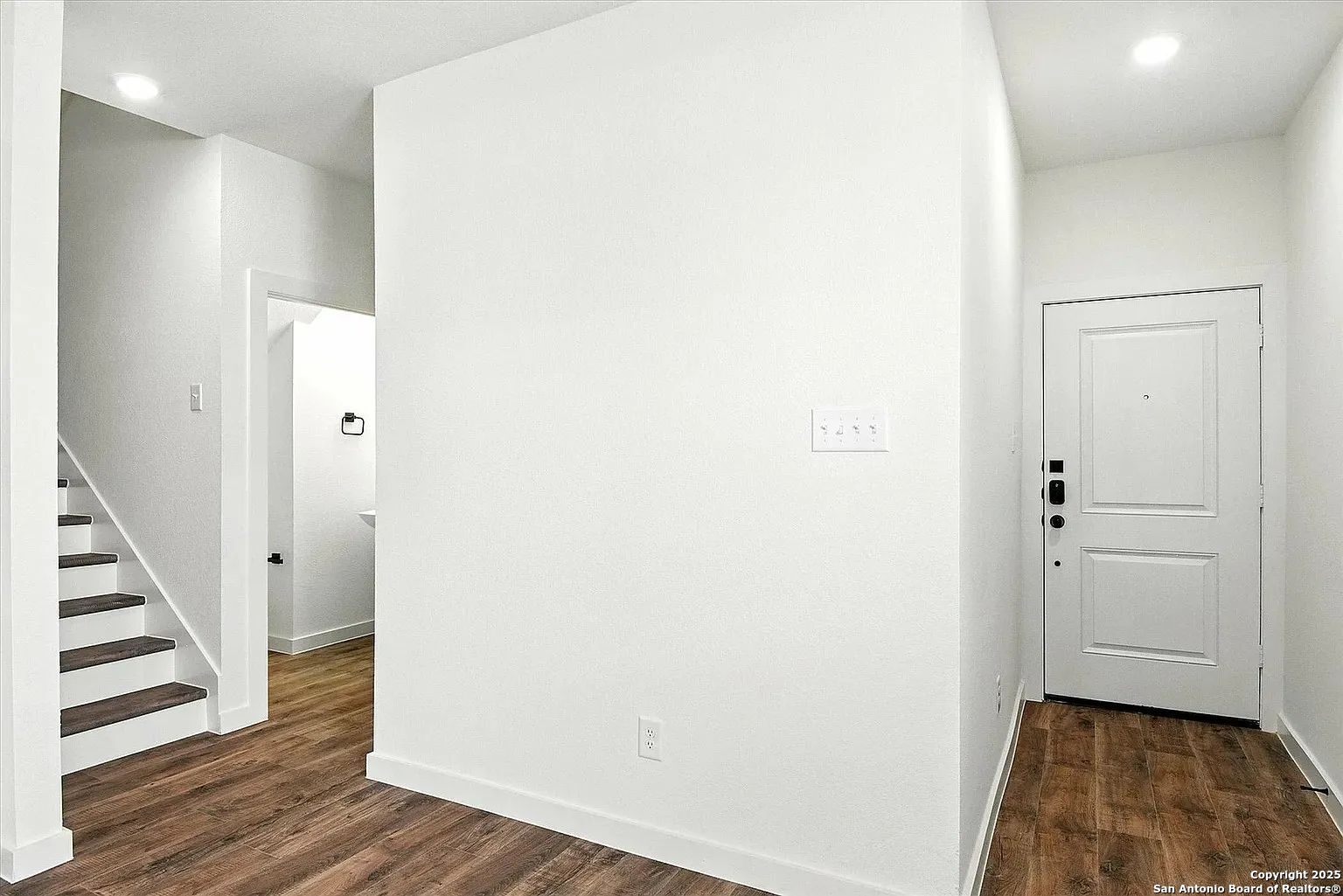 1809 North Peach Creek Drive, Unit 3C Dayton, TX 77535 - Photo 11 of 23 a view of a hallway with wooden floor and entryway