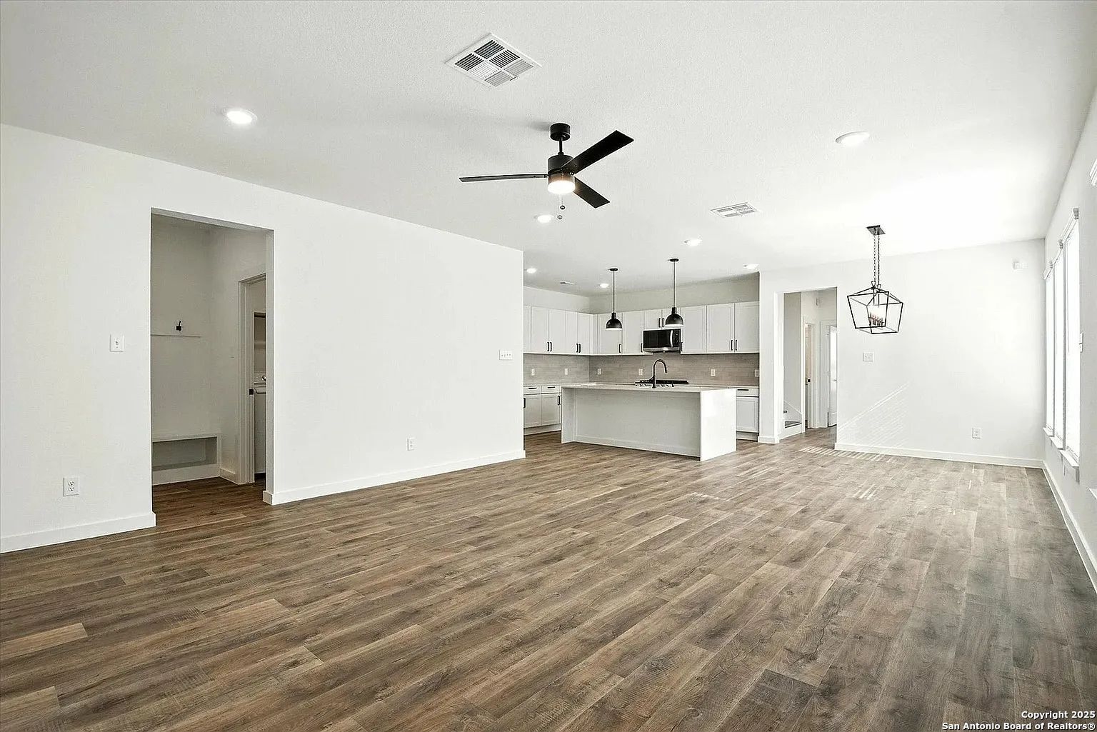 1809 North Peach Creek Drive, Unit 3C Dayton, TX 77535 - Photo 12 of 23 a view of a kitchen with a sink and a refrigerator