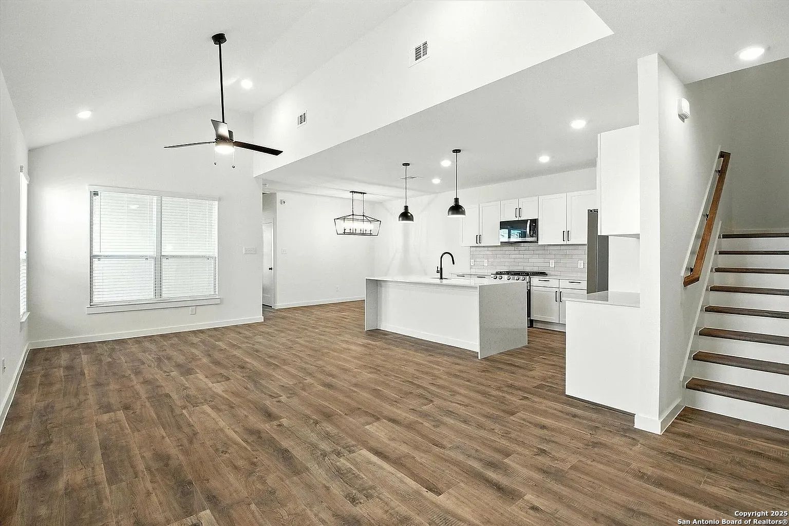 1809 North Peach Creek Drive, Unit 3C Dayton, TX 77535 - Photo 13 of 23 a view of a kitchen with wooden floor and electronic appliances