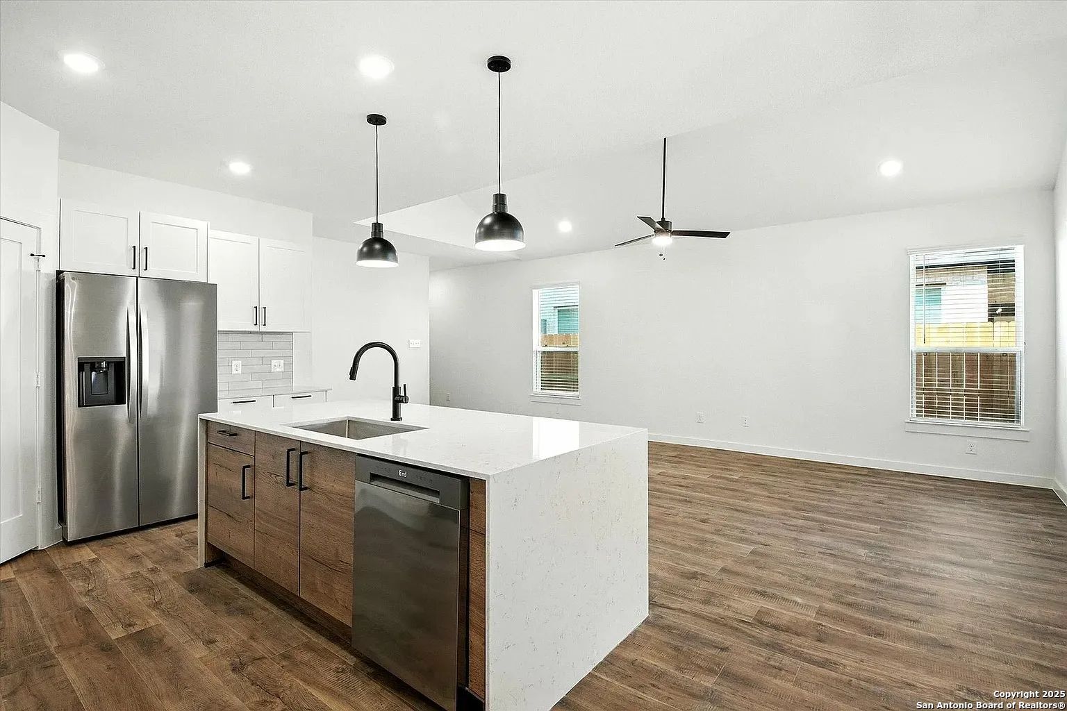 1809 North Peach Creek Drive, Unit 3C Dayton, TX 77535 - Photo 14 of 23 a kitchen with stainless steel appliances granite countertop a sink a refrigerator and a stove