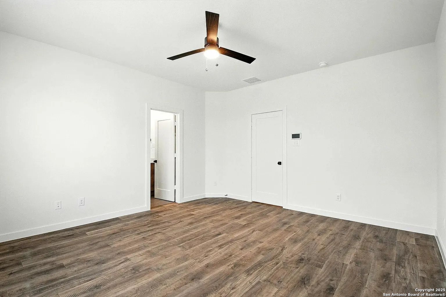 1809 North Peach Creek Drive, Unit 3C Dayton, TX 77535 - Photo 15 of 23 a view of empty room with wooden floor