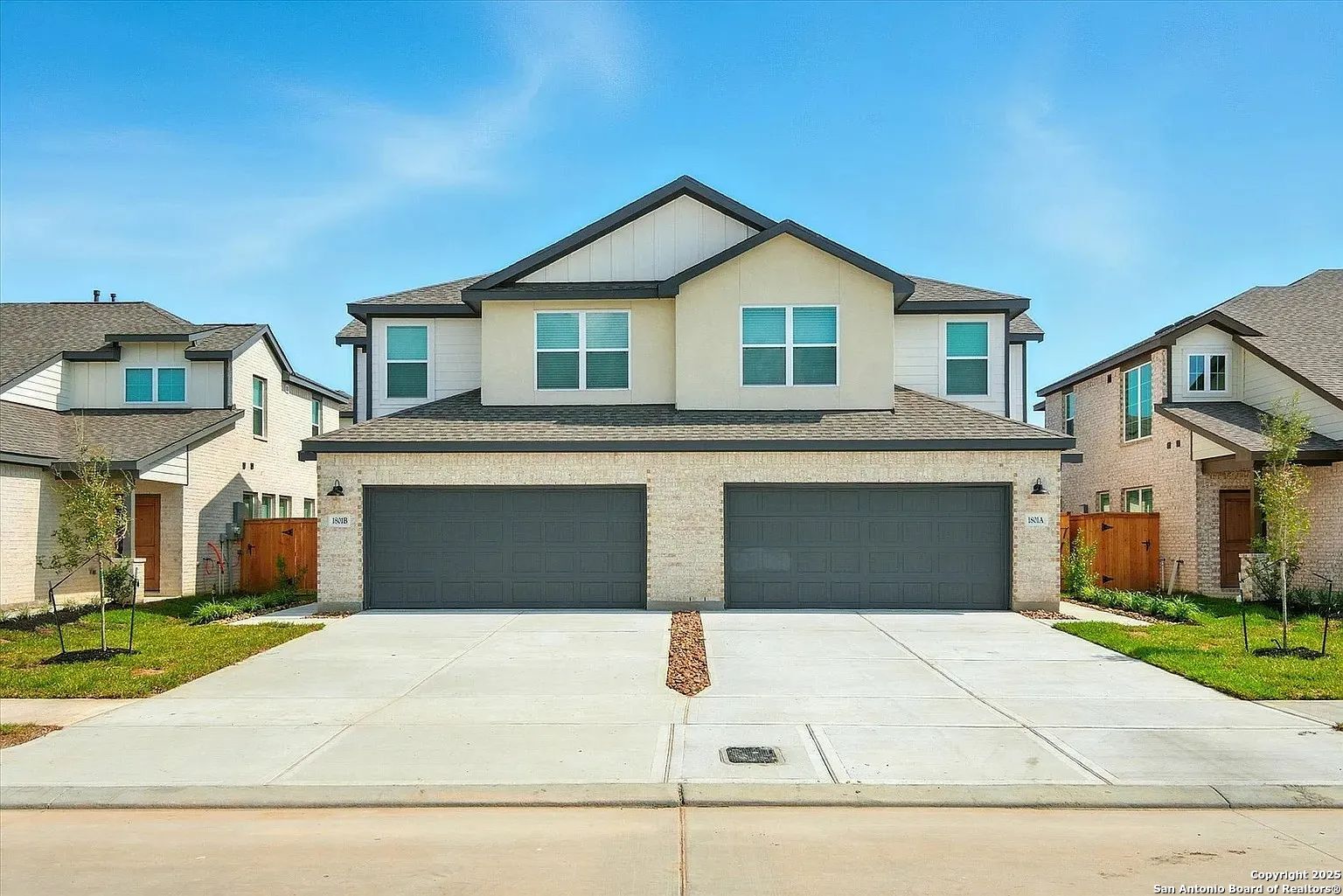 1809 North Peach Creek Drive, Unit 3C Dayton, TX 77535 - Photo 19 of 23 a front view of a house with garage