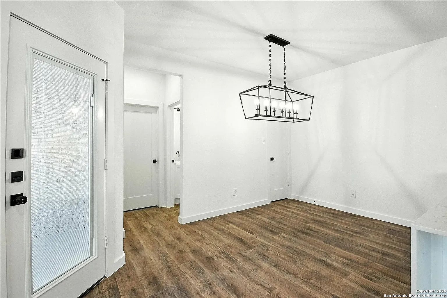 1809 North Peach Creek Drive, Unit 3C Dayton, TX 77535 - Photo 3 of 23 a view of a room with wooden floor and window