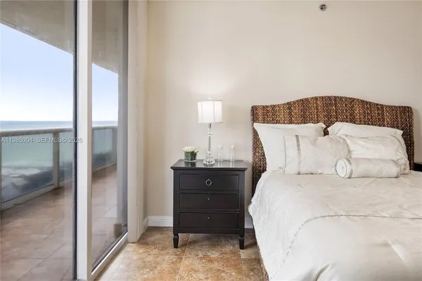 a bedroom with a bed and a table