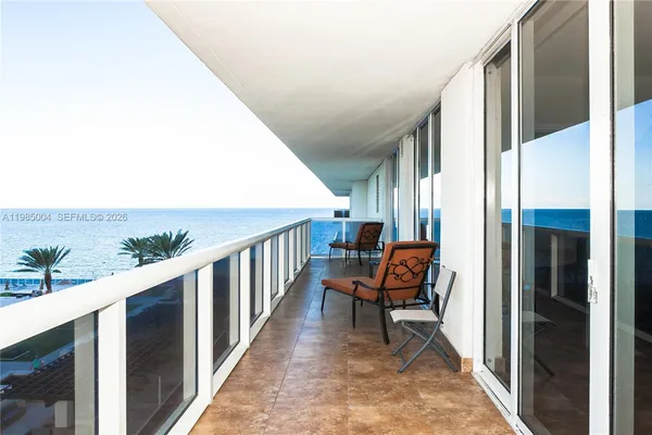 a view of a balcony with chairs