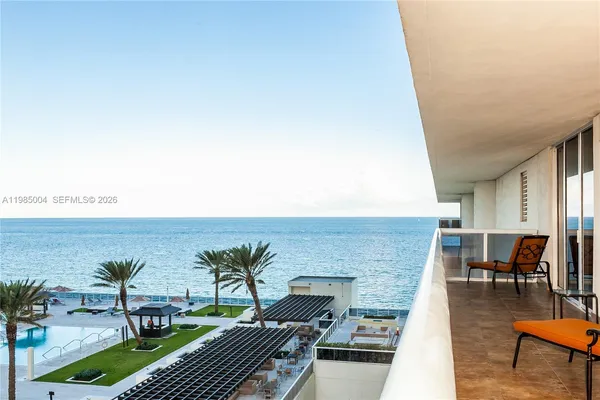 swimming pool view with a outdoor seating