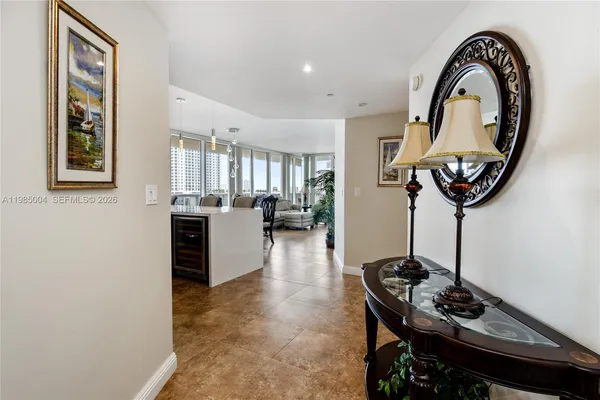 a view of a livingroom with furniture and entryway
