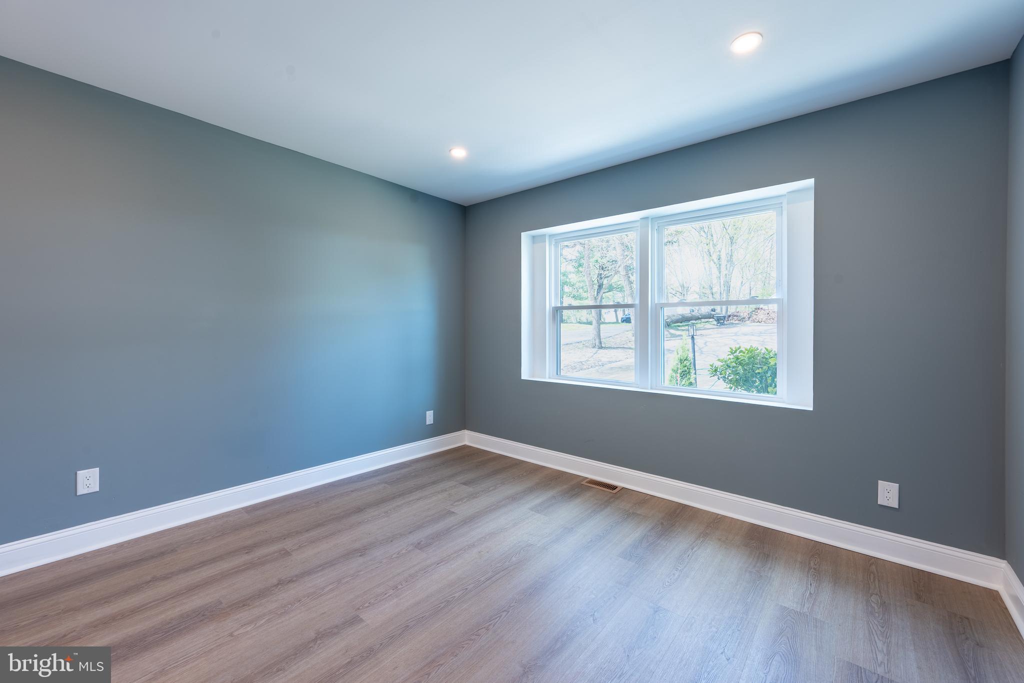 3 Slalom Court Pine Hill, NJ 08021 - Photo 11 of 47 an empty room with wooden floor and windows