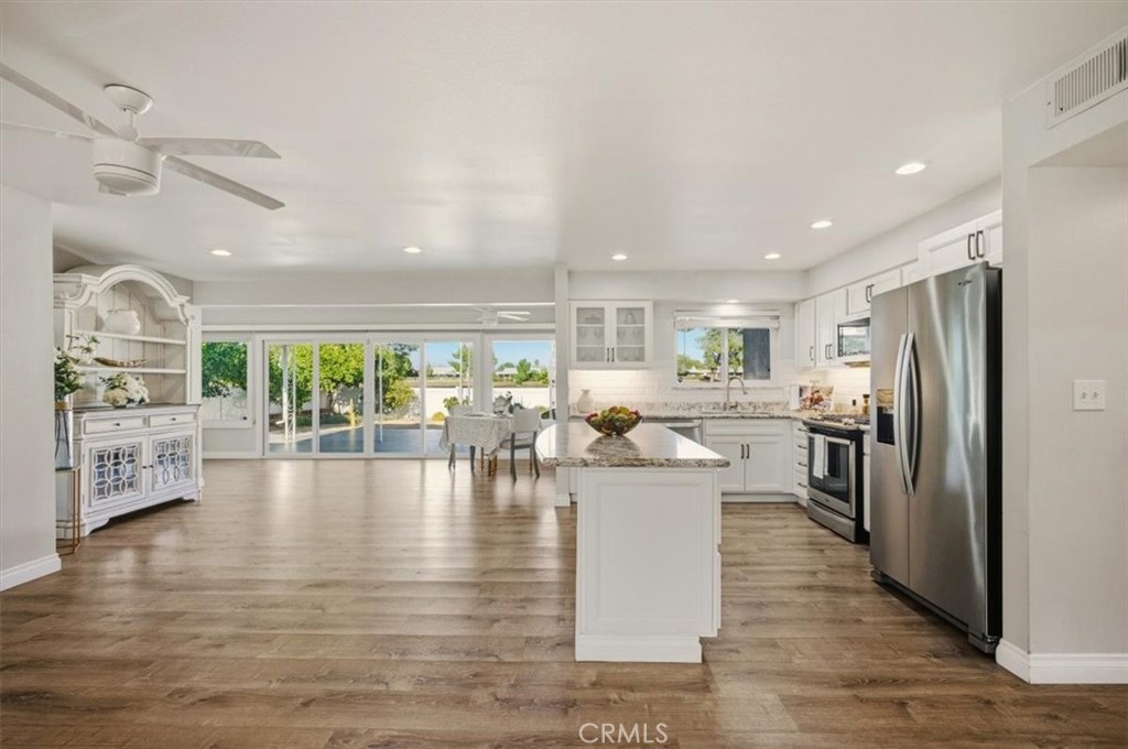 29326 Carmel Road Menifee, CA 92586 - Photo 11 of 44 a living room with fireplace furniture and a large window
