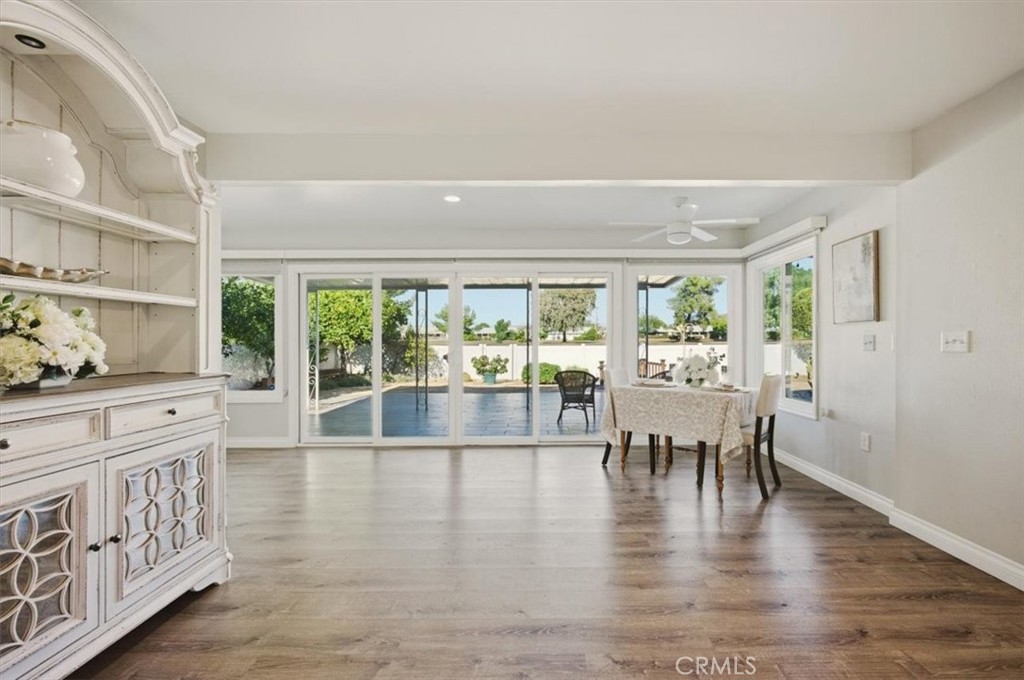 29326 Carmel Road Menifee, CA 92586 - Photo 22 of 44 a view of a dining room with furniture window and wooden floor