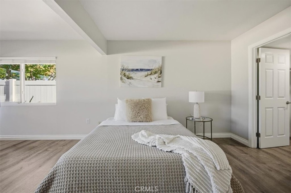 29326 Carmel Road Menifee, CA 92586 - Photo 27 of 44 a bedroom with a bed and a night stand