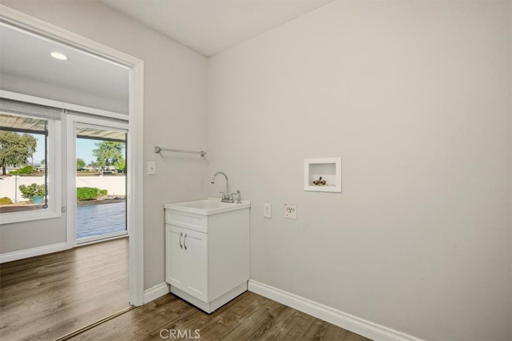 29326 Carmel Road Menifee, CA 92586 - Photo 35 of 44 an empty room with wooden floor and windows
