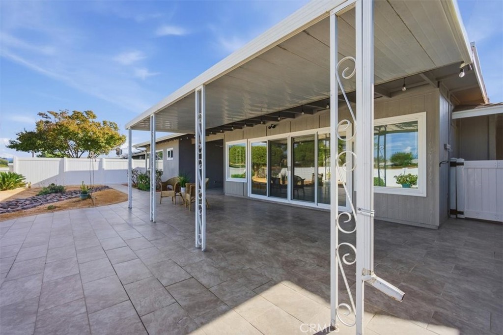 29326 Carmel Road Menifee, CA 92586 - Photo 37 of 44 a view of a patio with table and chairs and potted plants