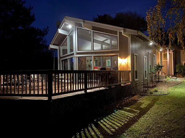a view of a house with a yard