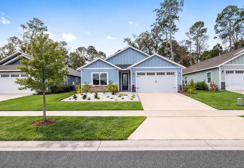 1759 Southwest 67th Circle Gainesville, FL 32607 - Photo 1 of 66 a front view of a house with a garden