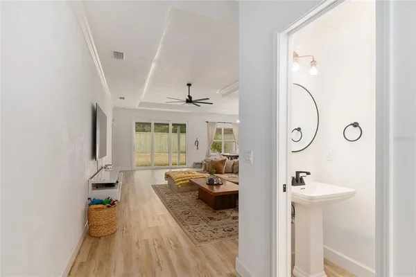 a spacious bedroom with a bed and a flat screen tv