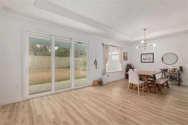 a large kitchen with stainless steel appliances kitchen island granite countertop a sink a stove and a refrigerator