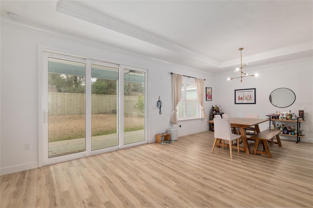 1759 Southwest 67th Circle Gainesville, FL 32607 - Photo 17 of 66 a view of a dining room with furniture window and wooden floor