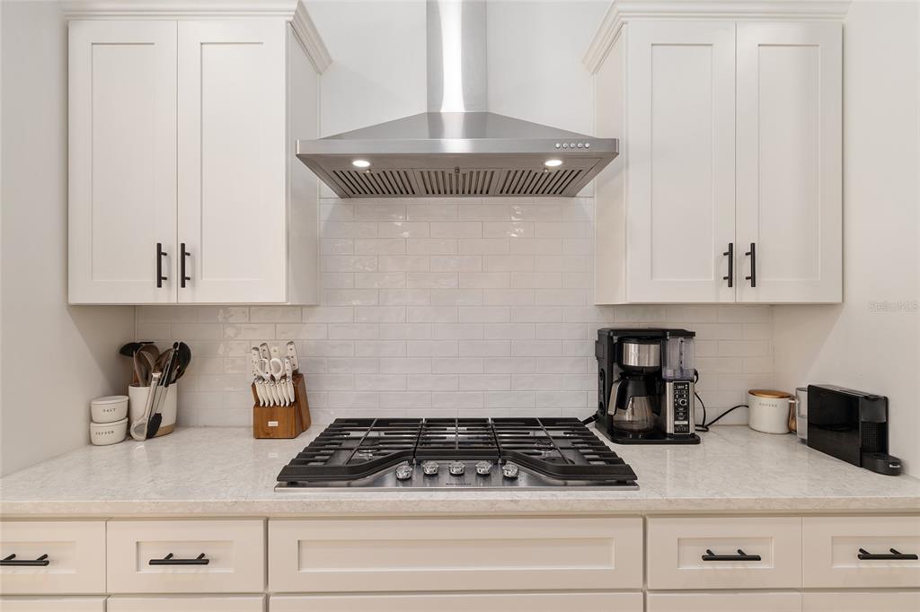 1759 Southwest 67th Circle Gainesville, FL 32607 - Photo 26 of 66 a kitchen with white cabinets and appliances
