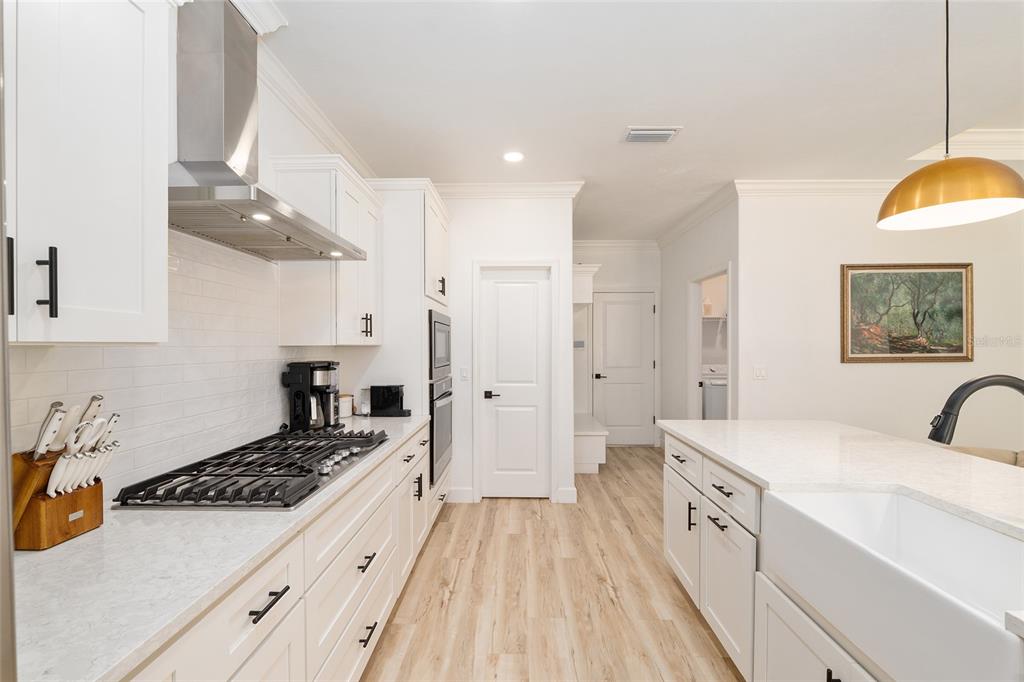 1759 Southwest 67th Circle Gainesville, FL 32607 - Photo 27 of 66 a kitchen with stainless steel appliances a stove a sink a refrigerator and cabinets
