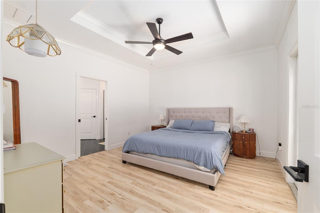 1759 Southwest 67th Circle Gainesville, FL 32607 - Photo 32 of 66 a bedroom with a bed and wooden floor