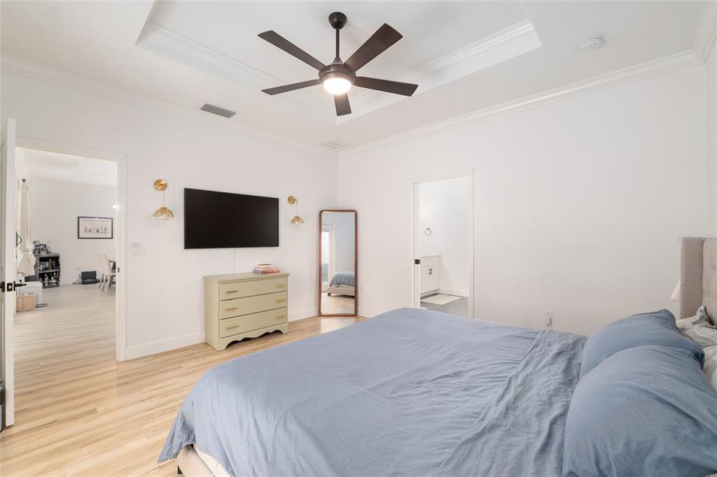 1759 Southwest 67th Circle Gainesville, FL 32607 - Photo 33 of 66 a bedroom with a bed and a flat screen tv