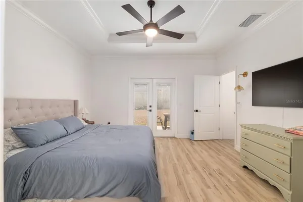 a view of walk in closet with clothes