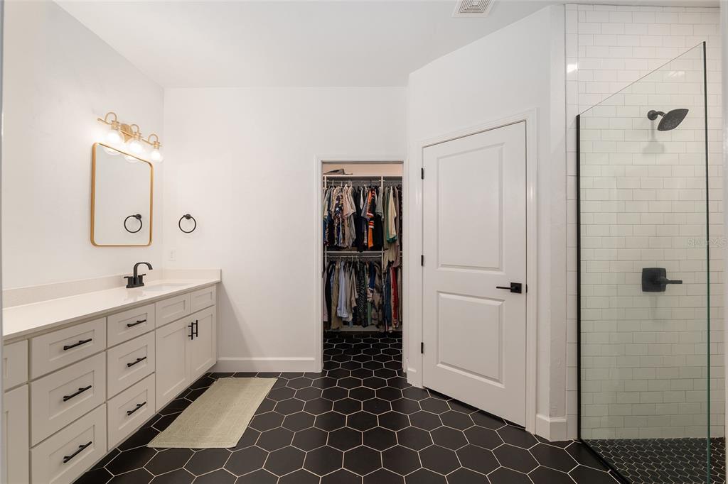 1759 Southwest 67th Circle Gainesville, FL 32607 - Photo 35 of 66 a bathroom with a double vanity sink and mirror
