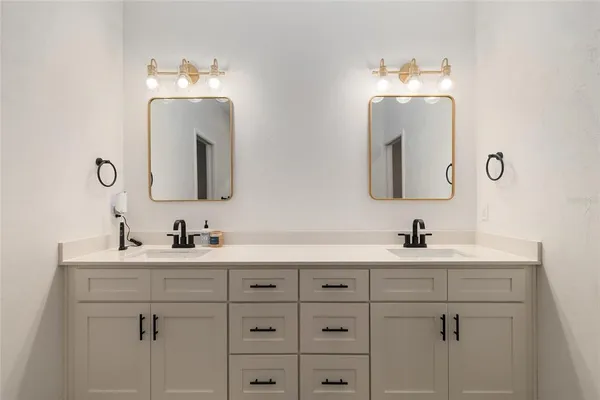 a bathroom with a sink toilet tub and shower