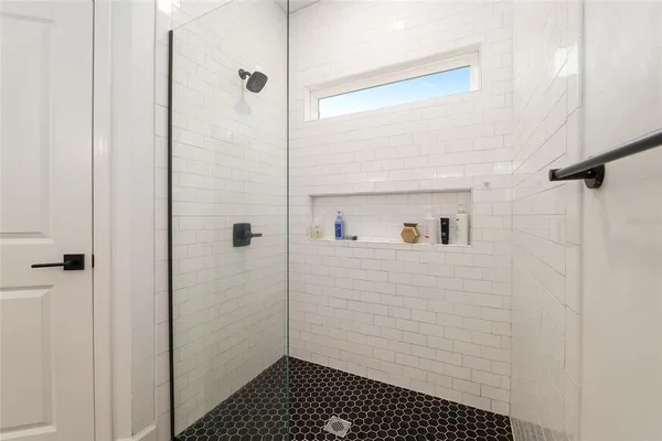 a en suite bathroom with a sink and a shower