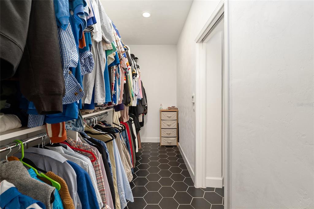 1759 Southwest 67th Circle Gainesville, FL 32607 - Photo 40 of 66 a view of walk in closet with clothes