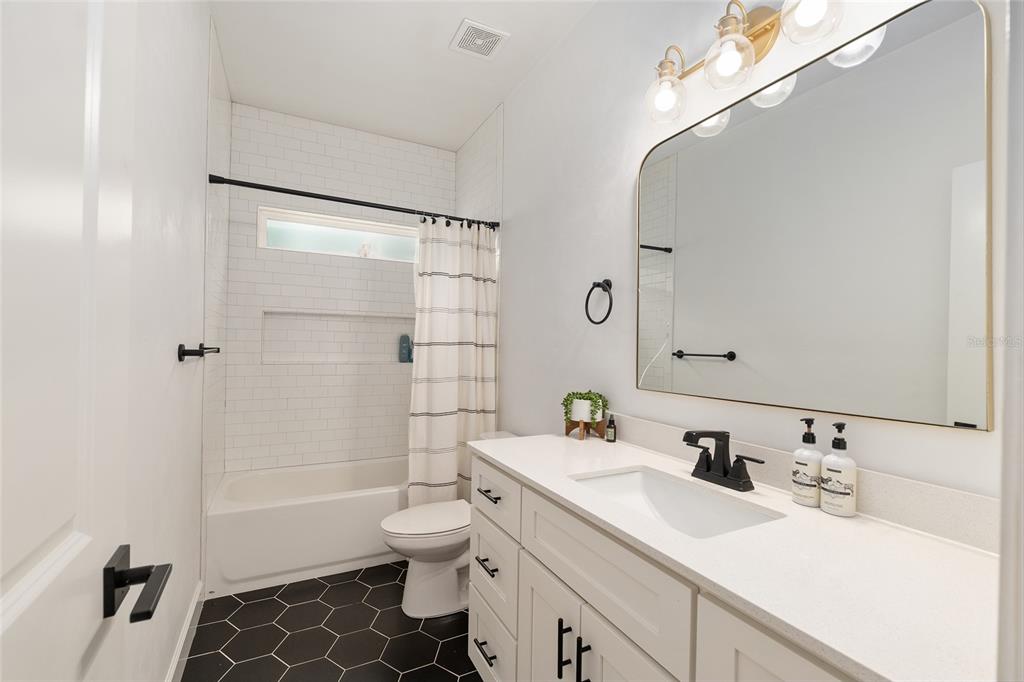 1759 Southwest 67th Circle Gainesville, FL 32607 - Photo 42 of 66 a bathroom with a sink toilet tub and shower
