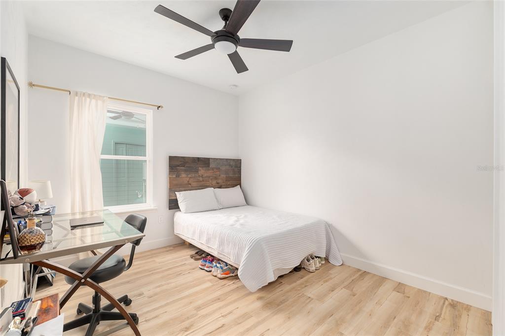 1759 Southwest 67th Circle Gainesville, FL 32607 - Photo 44 of 66 a bedroom with a bed and a window