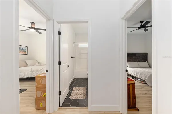 a view of a swimming pool with outdoor seating and lake view