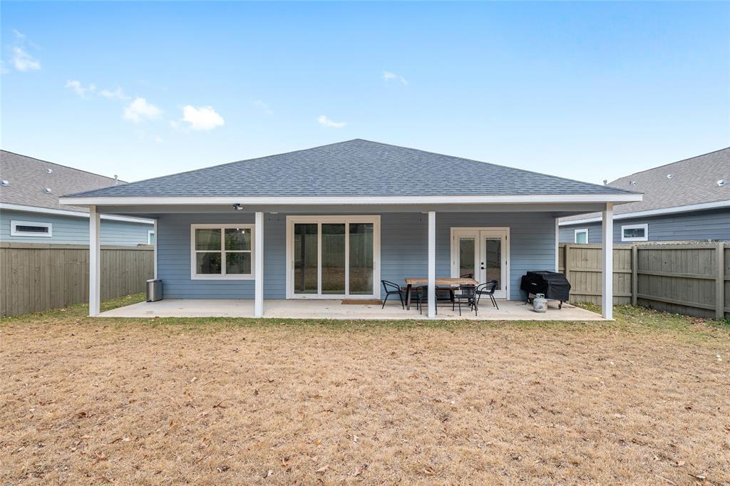 1759 Southwest 67th Circle Gainesville, FL 32607 - Photo 57 of 66 a front view of house with yard outdoor seating and porch