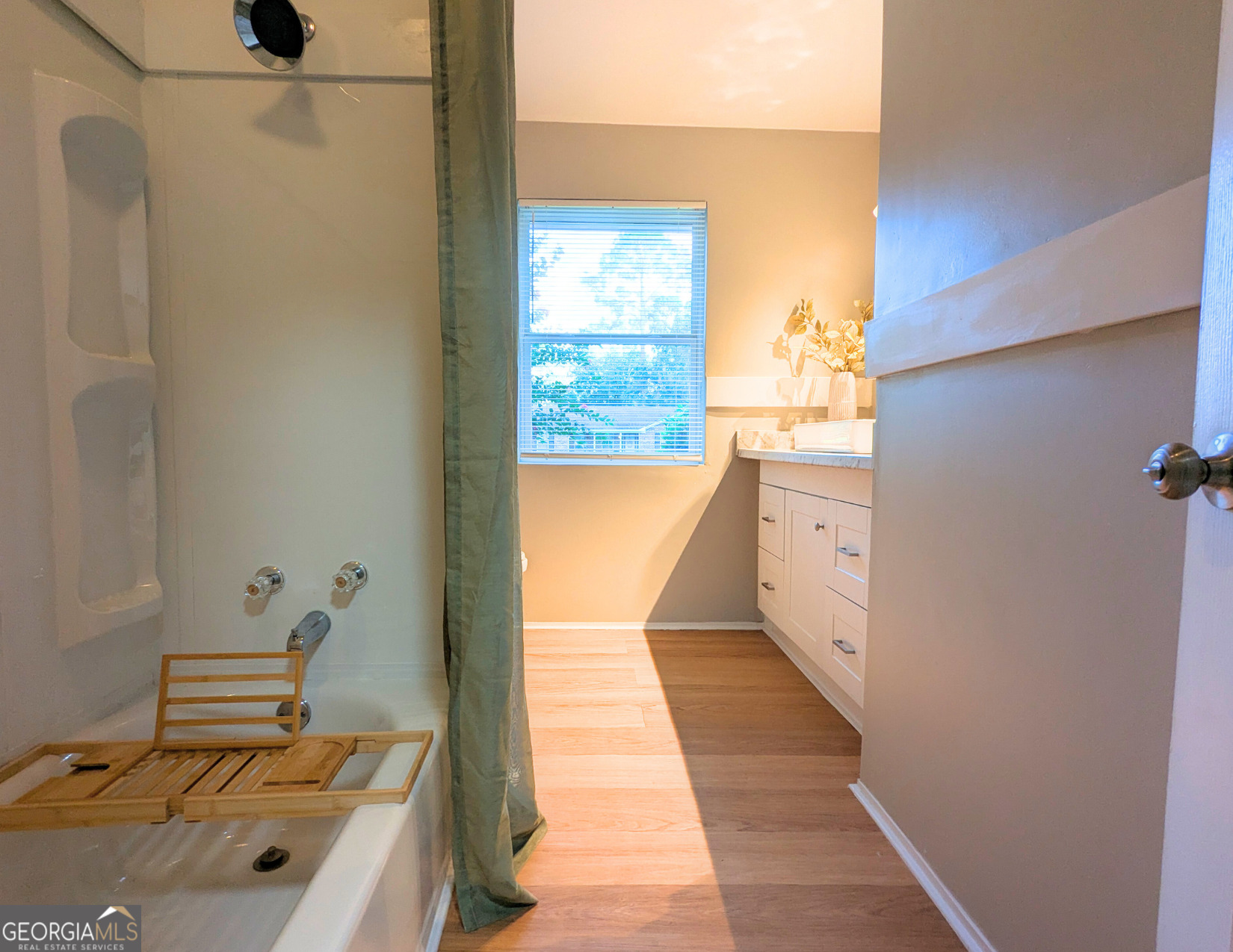 1701 Sharon Drive Albany, GA 31707 - Photo 13 of 18 a bathroom with a tub sink and mirror