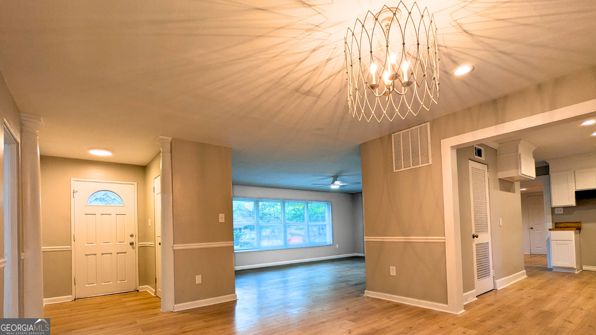 1701 Sharon Drive Albany, GA 31707 - Photo 2 of 18 wooden floor in an empty room with a window