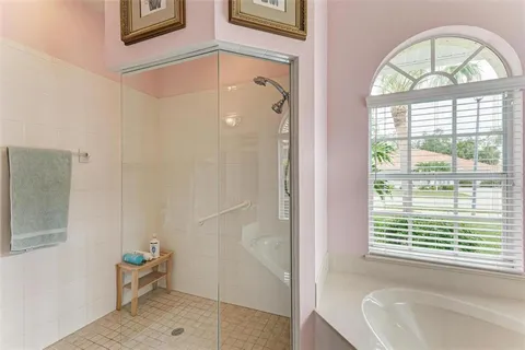 a bedroom with a bed and a lamp on table