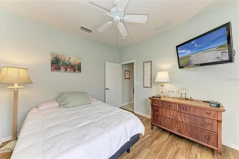 a bedroom with bed and a window