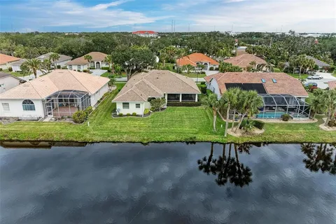 an aerial view of a house with a lake view