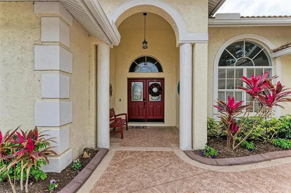 a view of room with workspace and windows