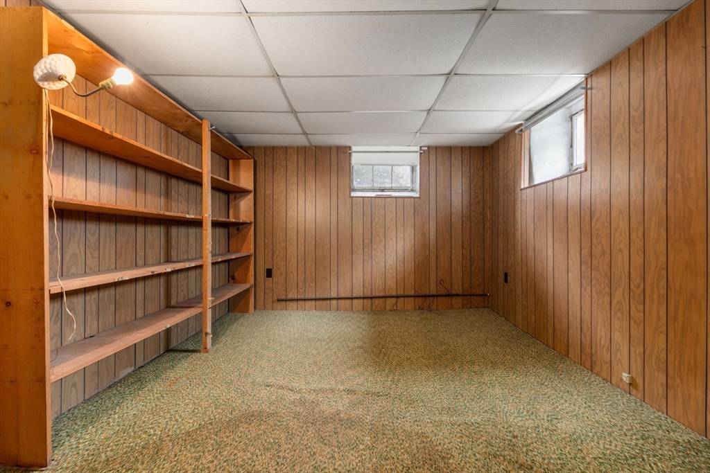 15 Atlantis Street Boston, MA 02132 - Photo 18 of 25 a view of an empty room with shelves