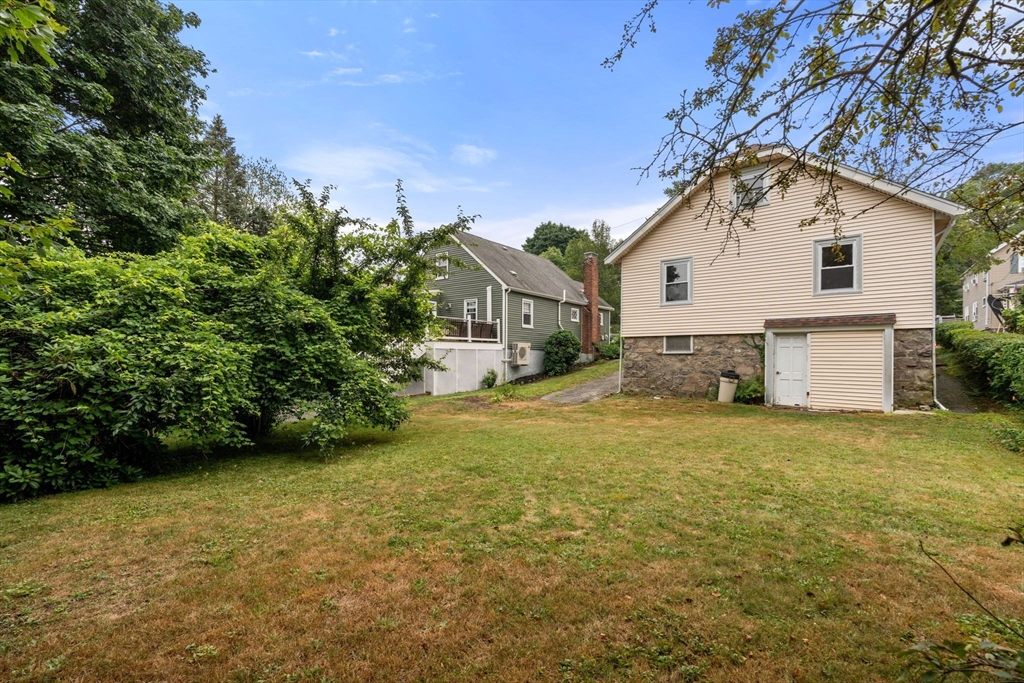 15 Atlantis Street Boston, MA 02132 - Photo 22 of 25 a view of a house with a yard and garage