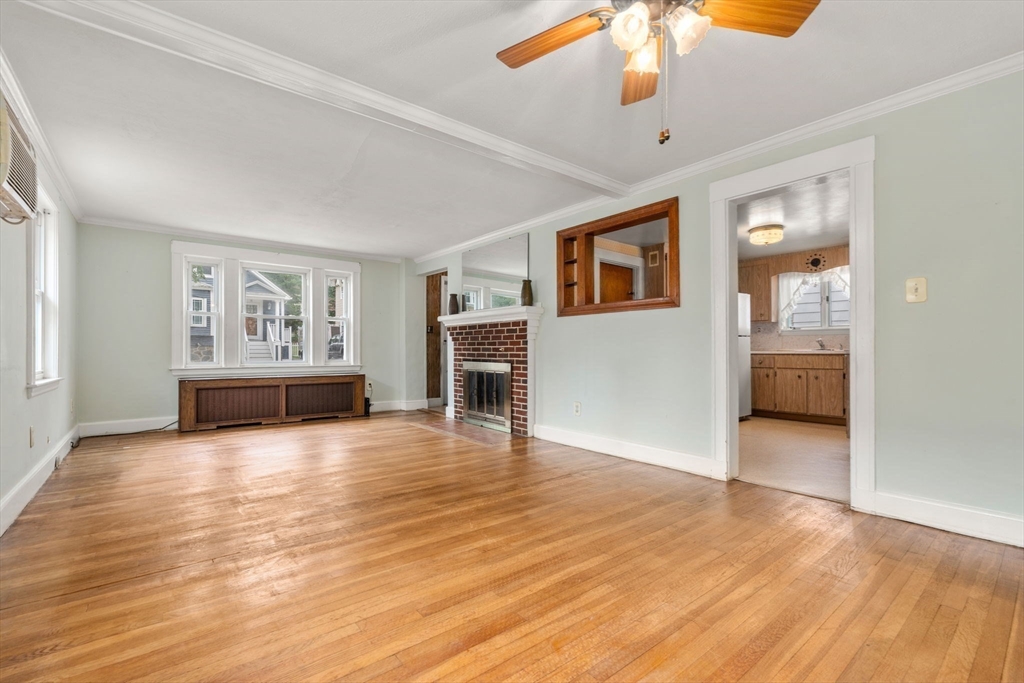 15 Atlantis Street Boston, MA 02132 - Photo 4 of 25 a view of an empty room with window and wooden floor