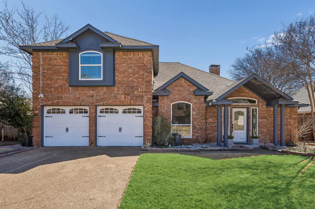 a front view of a house with yard