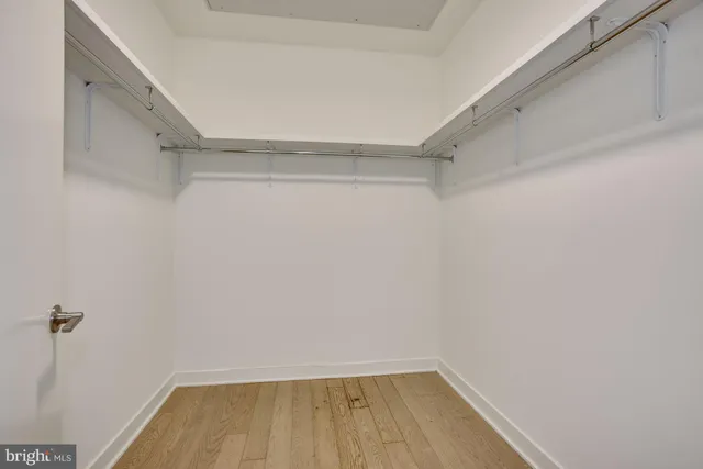a view of a room with shelf on the wall