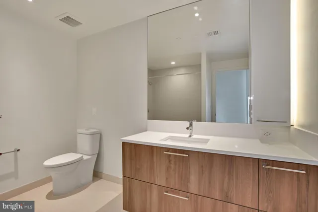 a bathroom with a sink toilet and vanity