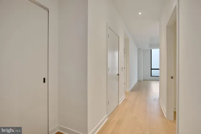 a view of a hallway with a white walls