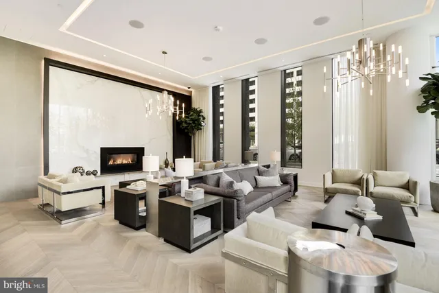 a living room with furniture large window and a flat screen tv