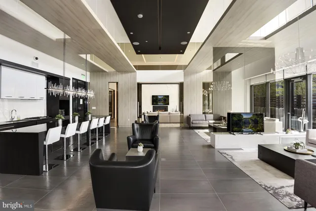 a living room with lots of furniture and white walls